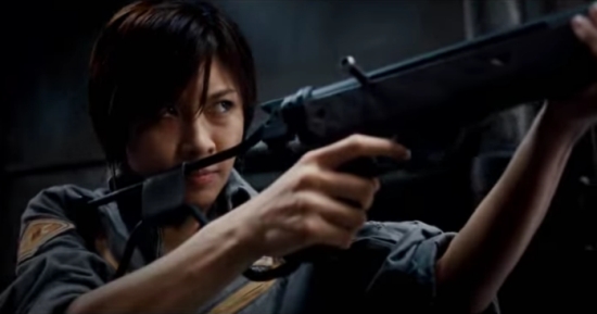 Ha Jiwon pointing a weapon off-screen while looking at something in the movie 'Sector 7.'