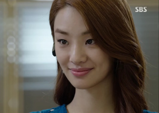 Stephanie Lee smiling as she looks at someone off-camera in the drama series 'Yong Pal.'