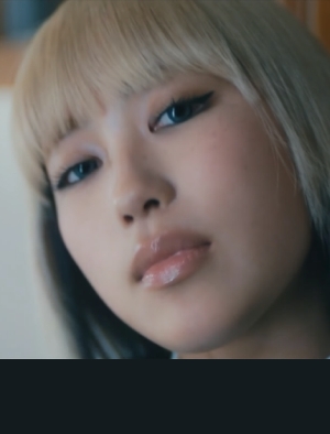 A close-up of Hinata in the new music video
